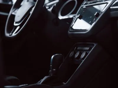 Gear stick. Front part of brand new automobile. Modern black interior. Conception of vehicles.